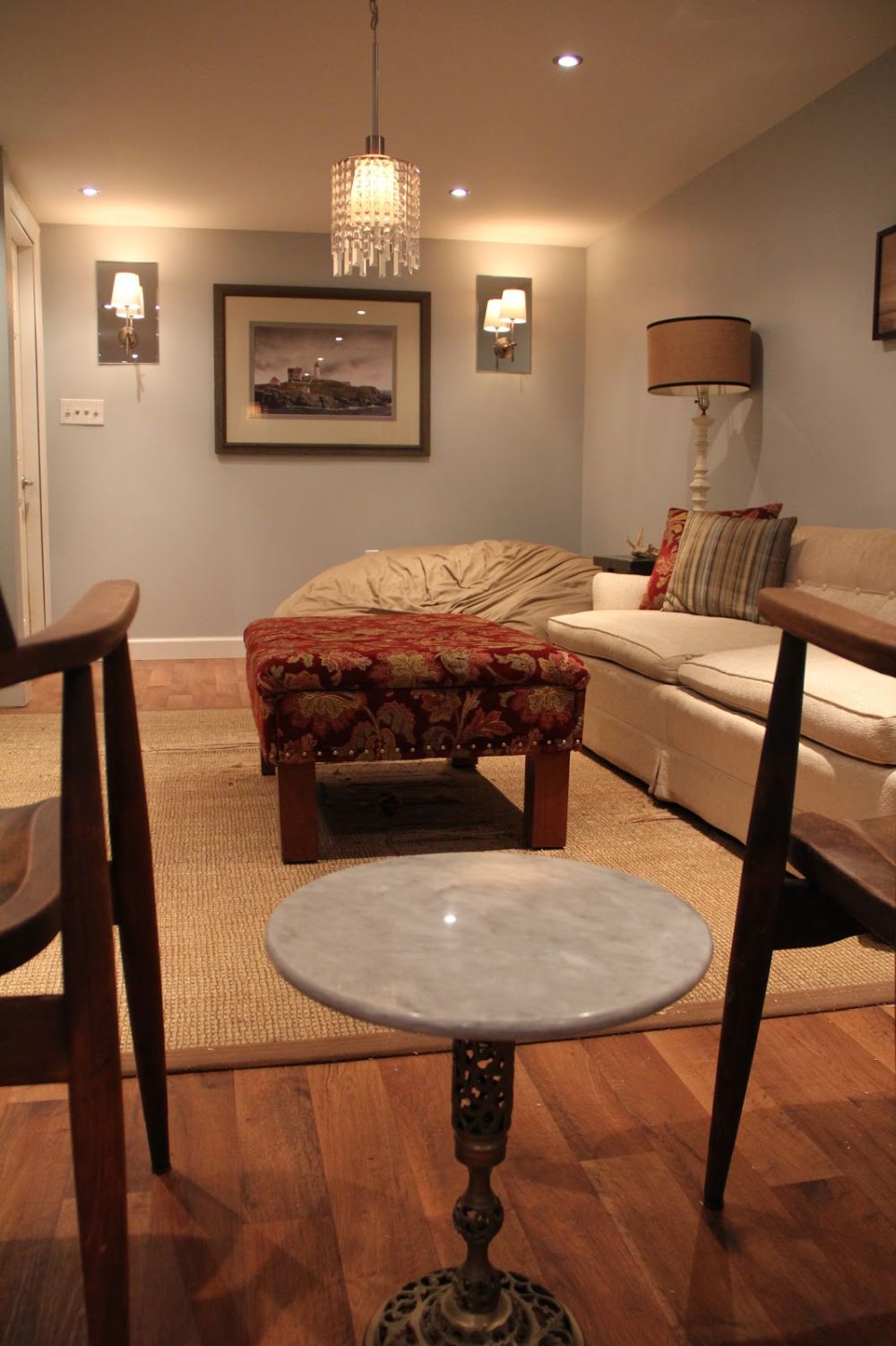 Grey walls and leather furniture for basement