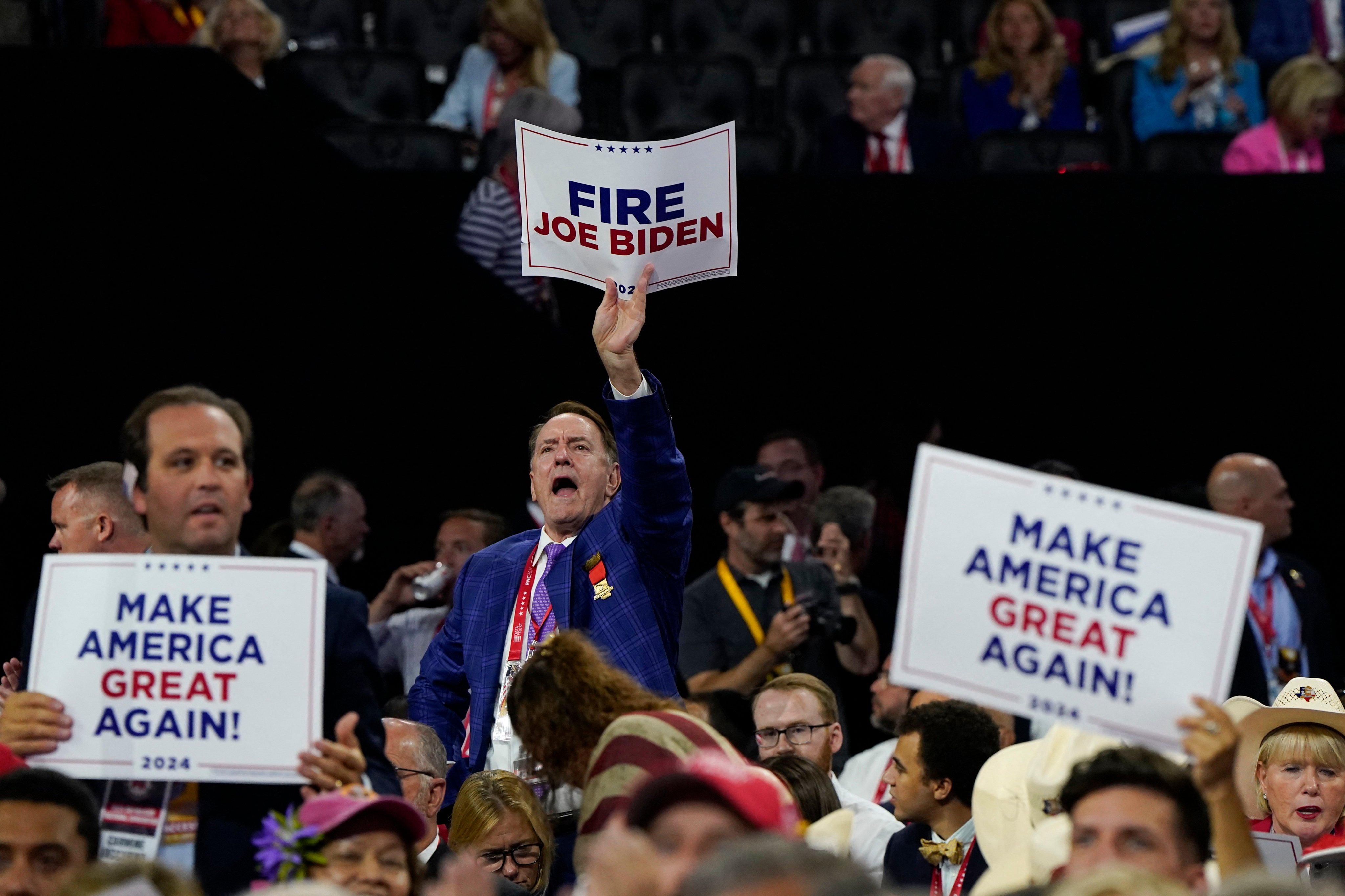 An attendee holds a Fire Joe Biden sign on Day 4 of the Republican National Convention (RNC) in Wisconsin, U.S on July 18, 2024. Photo: Reuters