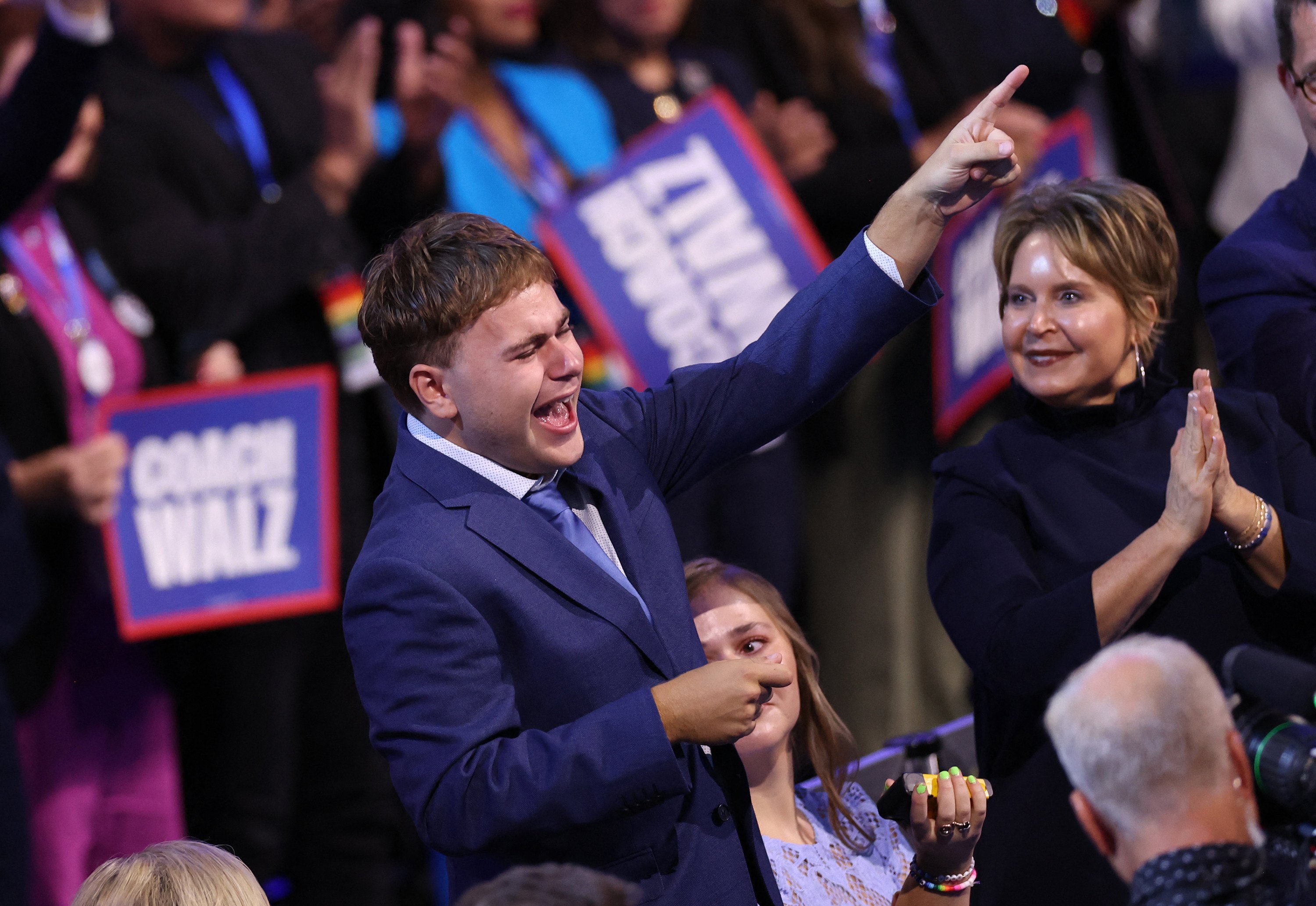 Gus Walz cheers as his father, Minnesota Governor and 2024 Democratic vice-presidential candidate Tim Walz, speaks on the third day of the Democratic National Convention in Chicago on August 21. Photo: AFP