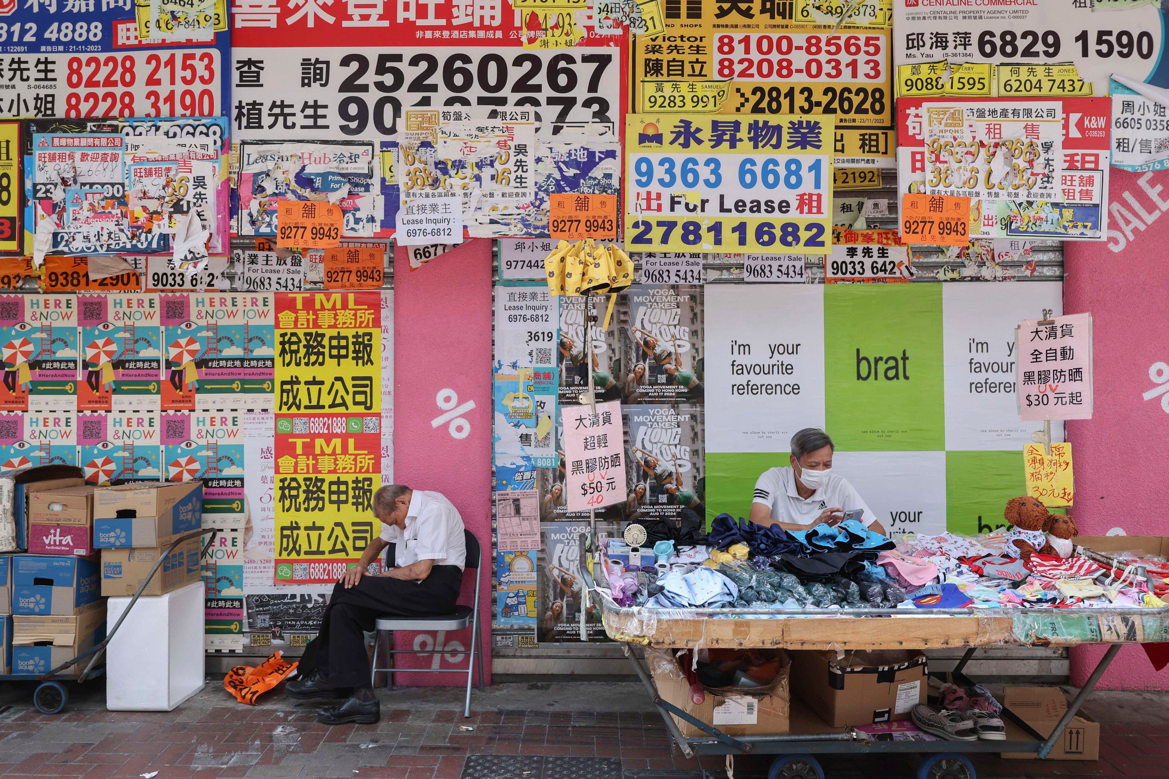 A man takes a nap outside closed shops in Causeway Bay on August 9. Photo: Edmond So