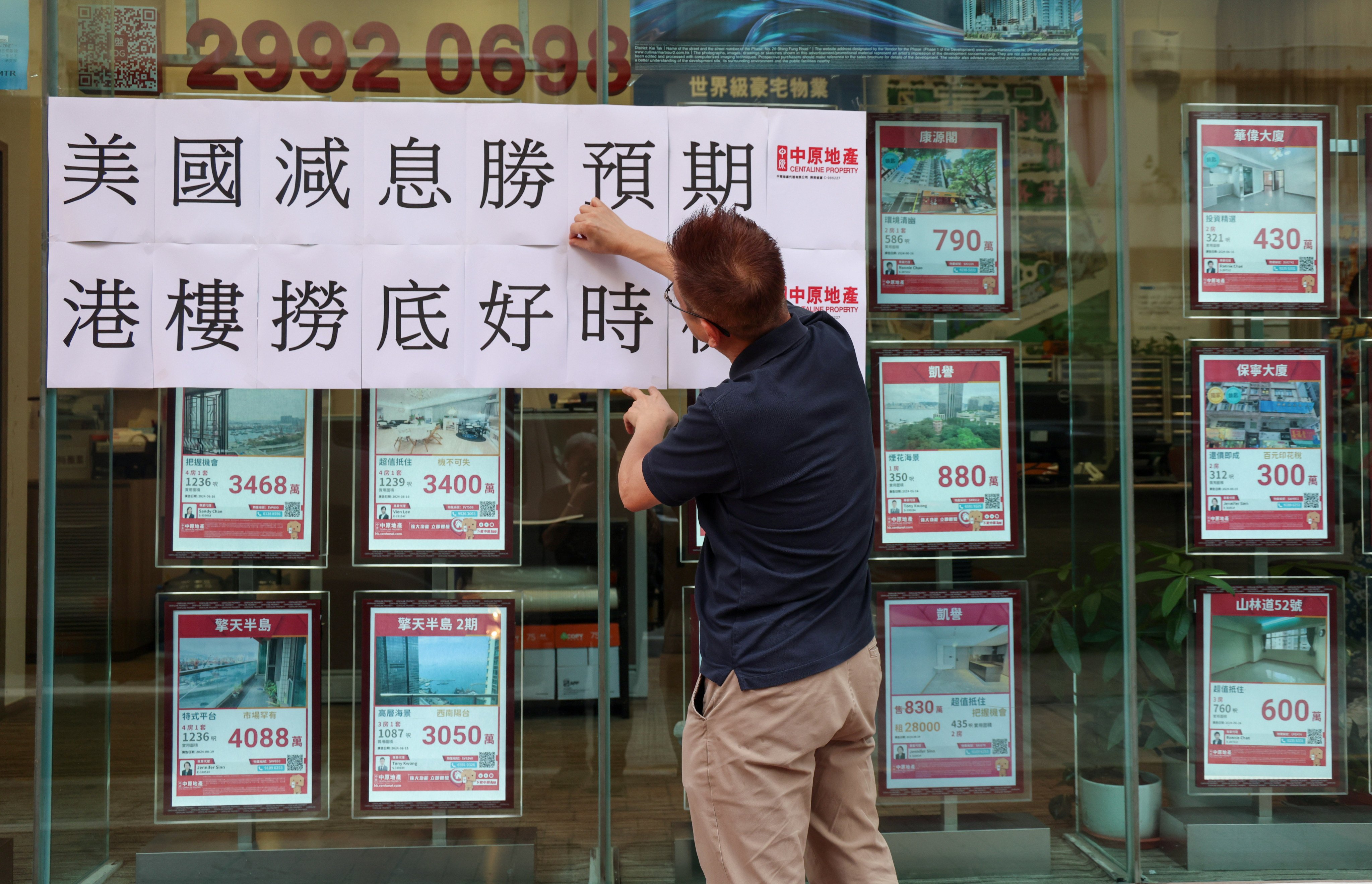 Outside a real-estate agency in Kowloon. Photo: SCMP/Jelly Tse 