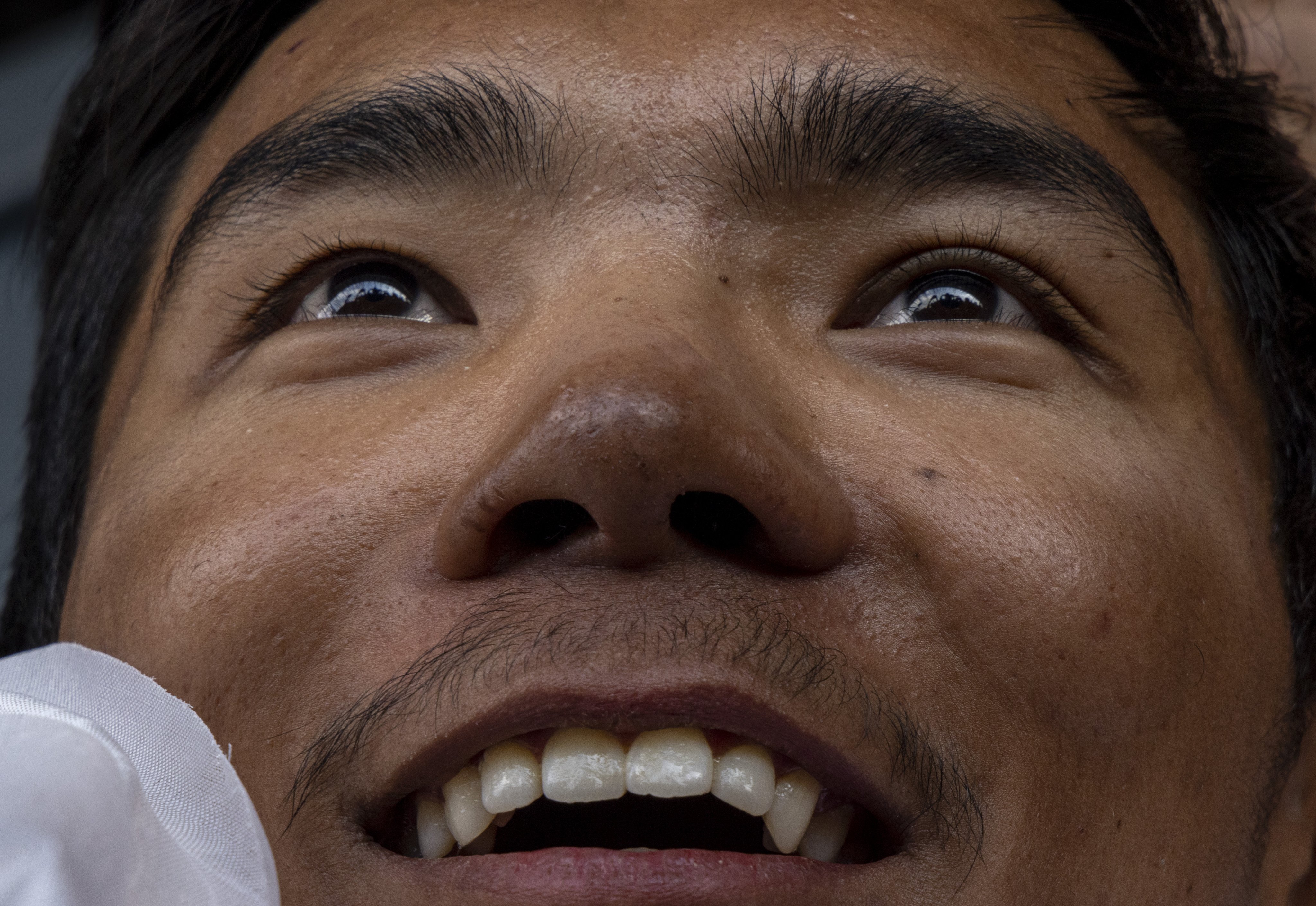 Nepalese mountaineer Nima Rinji Sherpa, 18, reacts as he arrives in Kathmandu on Monday. Photo: EPA-EFE/