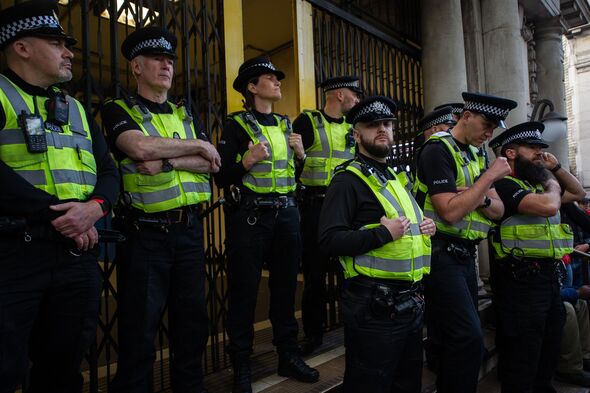 British transport Police look on as hundreds of activists blockade Waterloo station in protest at the bombing of Gaza