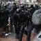 Protesters throw bricks and bottles in clashes with police during Belfast march