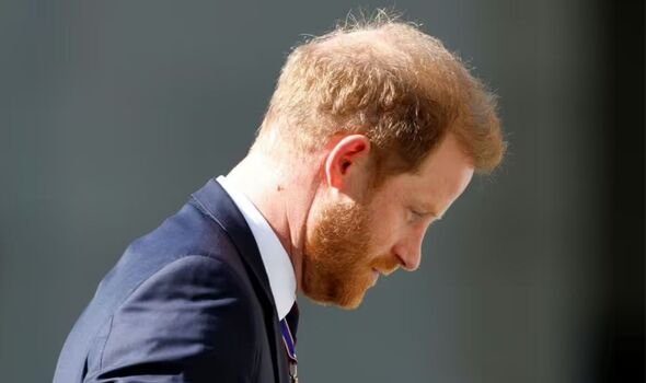 Prince Harry looking down