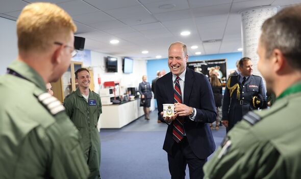 Prince William speaking with Captain Brian Wills