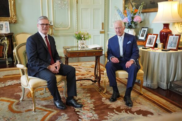 Keir Starmer sits with King Charles