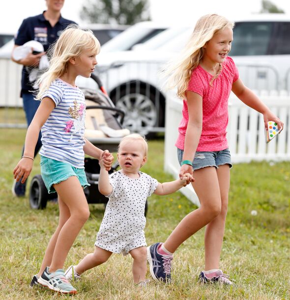 Lena holding hands with her cousins