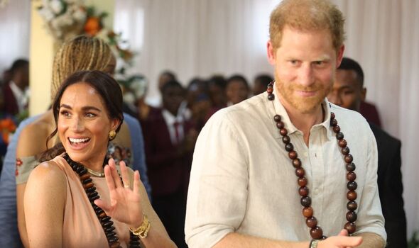 Meghan Markle and Prince Harry waving