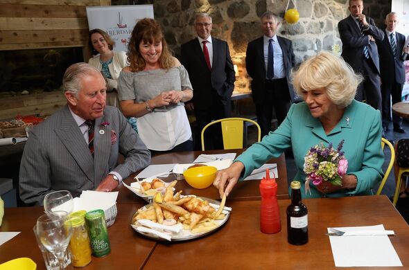 Camilla and Charles enjoying fish and chips