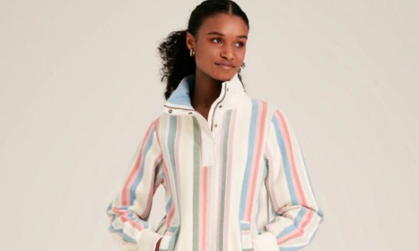 A model wearing Joules Striped Half Zip Sweatshirt