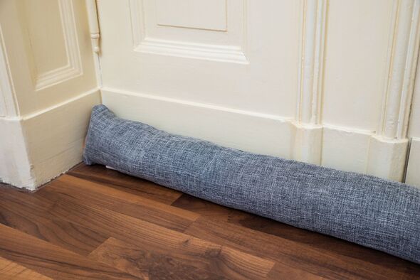 Draught excluder under door