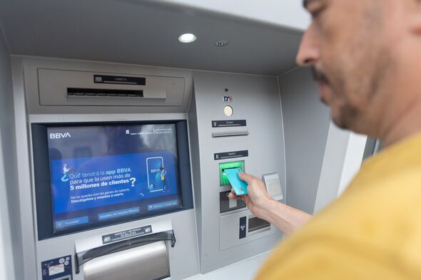 Man using ATM