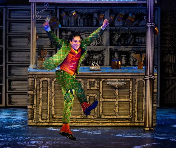 Rodion Pogossov as Papageno enjoying himself and his wine