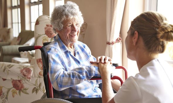 Elderly lady with carer