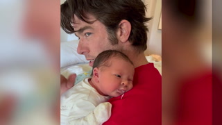 Olivia Munn films John Mulaney cuddling newborn daughter after 