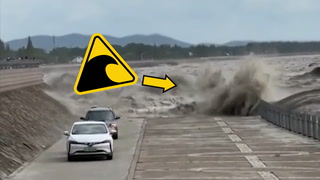 Close call: Cars speed up to escape tidal bore wave