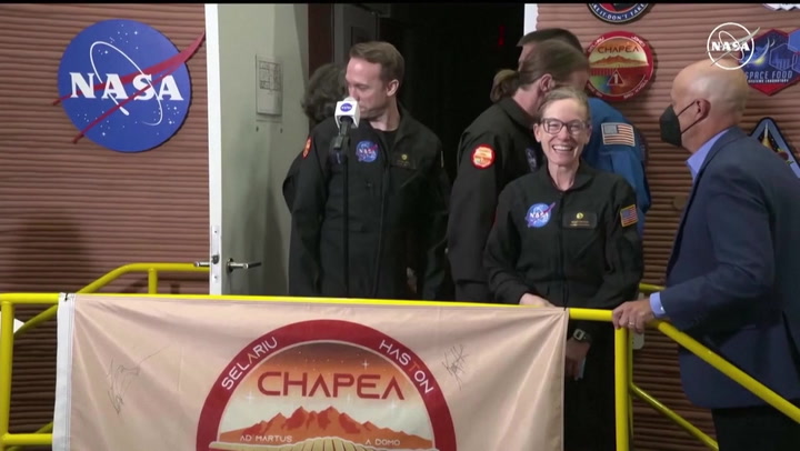 Volunteer crew smile as they emerge from Mars simulator for first time in 378 days
