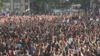 Hundreds celebrate in Paris as exit poll suggests loss for far-right