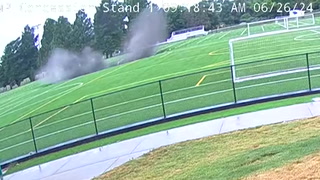 Moment 100ft-wide sinkhole opens up and collapses football field