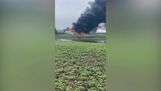 Huge fire rages after train carrying hazardous materials derails