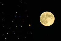 A bright supermoon is seen from Sapporo's Chuo Ward on Oct. 17, 2024. The lights of the Sapporo TV Tower are seen on the left. (Mainichi/Taichi Kaizuka)