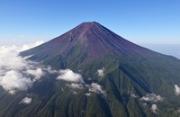 This photo taken from a Kyodo News helicopter on Aug. 10, 2024, shows Mount Fuji, Japan's highest mountain, seen from the Yamanashi prefectural side. The 3,776-meter mountain in central Japan straddles Shizuoka and Yamanashi prefectures. (Kyodo) 