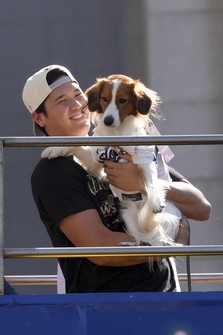 Los Angeles Dodgers' Shohei Ohtani holds his dog Decoy during the Los Angeles Dodgers baseball World Series championship parade on Nov. 1, 2024, in Los Angeles. (AP Photo/Jae C. Hong)