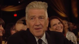 A close up of David Lynch in the audience of the 2019 Governors Awards, where he was being honored. 