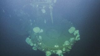 Researchers dive to the wreck of the WW II-era aircraft, the USS Independence.