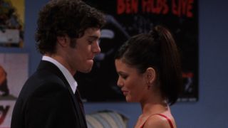 Seth (Adam Brody) and Summer (Rachel Bilson) standing close to each other on the O.C.