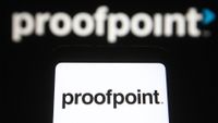 Proofpoint logo and branding pictured on a smartphone screen with branding in background.