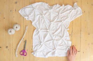 A knotted white t-shirt on a table