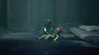 Low looks concerned at Alone who's sat on the floor in Little Nightmares 3.