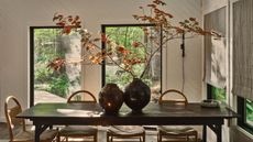 dining table in cabin with views of the wood