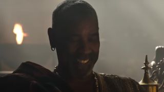 Denzel Washington smiling in Gladiator II