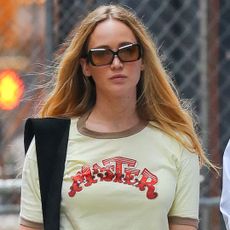Jennifer Lawrence wearing a vintage ringer tee and Tory Burch flats while walking in New York City
