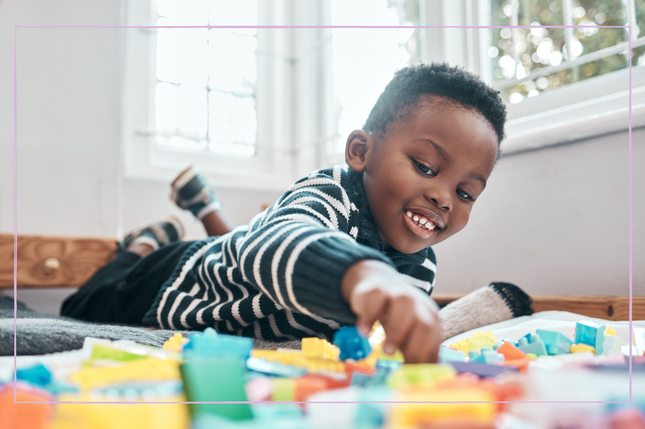 Boy playing with toys at home