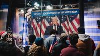 Onlookers in Times Square watch ABC presidential election coverage