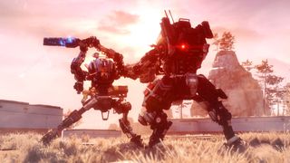 Titanfall screenshot of two mechs engagednin combat in a grassy outdoor arena