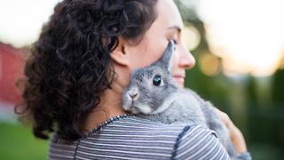 Woman holding rabbit