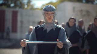 Florence Pugh holds a scroll with an expression of concern in Dune: Part Two.