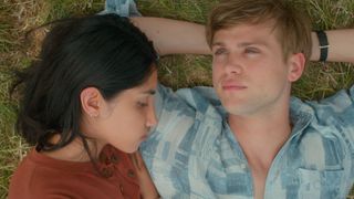 A close up shot of Emma and Dexter lying on some grass in Netflix's One Day TV show