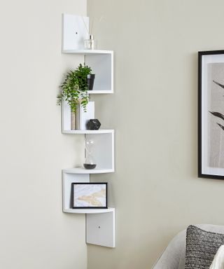 white corner shelf in a neutral plain living room