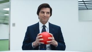 Adam Scott as Mark holding a ball in Severance Season 2