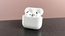 AirPods 4 in their case, with the case lid open