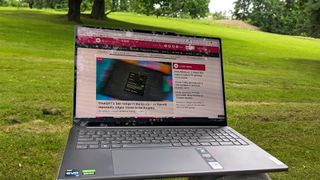 Lenovo Slim Pro 9i browsing Windows Central on battery power in natural lighting