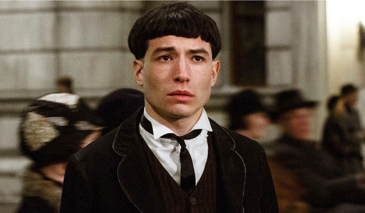 Ezra Miller looking worried with his bowl cut in Fantastic Beasts.