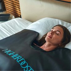 women using a sauna blanket