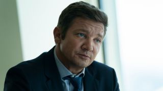 Jeremy Renner as Mike McLusky in season 2, episode 6 of Mayor of Kingstown looking sort of happy.